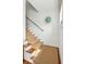 Carpeted staircase with wooden accents and stylish decoration at 62 Gadsden St # A, Charleston, SC 29401