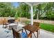 Inviting backyard patio area with table and chairs, set in a lush green lawn at 655 Jancus St, Charleston, SC 29414