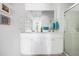 Bright bathroom with double vanity, white cabinets, and modern fixtures at 655 Jancus St, Charleston, SC 29414