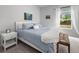Relaxing bedroom with a soft blue bed, decor, and lots of natural light at 655 Jancus St, Charleston, SC 29414
