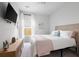 Charming bedroom with modern TV, soft tones, and natural light at 655 Jancus St, Charleston, SC 29414