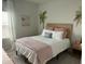Cozy bedroom featuring tropical accents, a comfortable bed, and warm natural light at 655 Jancus St, Charleston, SC 29414