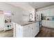 Stylish kitchen with white cabinets, stainless steel appliances, granite countertops, and a modern island at 655 Jancus St, Charleston, SC 29414