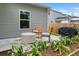 Outdoor patio, seating and grill overlooking the fenced yard of this home at 655 Jancus St, Charleston, SC 29414