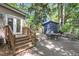 Backyard with a deck, wooden stairs, patio, and a shed with a star at 679 Edmonds Dr, Charleston, SC 29412