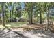 Spacious backyard with a storage shed and partial view of the house at 679 Edmonds Dr, Charleston, SC 29412