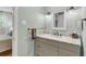 Well-lit bathroom featuring a granite vanity, soft color palette, and modern fixtures at 679 Edmonds Dr, Charleston, SC 29412