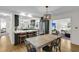A spacious dining room offers both an entertainment area and kitchen in an open floorplan at 679 Edmonds Dr, Charleston, SC 29412