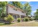 Charming two-story home with a brick facade, lush landscaping, and a welcoming front entrance at 679 Edmonds Dr, Charleston, SC 29412