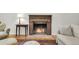 Living room fireplace with wood mantle and brick surround adds a cozy ambiance to the home at 679 Edmonds Dr, Charleston, SC 29412