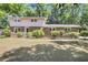 Charming two-story home with a brick facade, lush landscaping, and a well-maintained lawn at 679 Edmonds Dr, Charleston, SC 29412