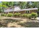 This property features a charming brick exterior, lush landscaping, and a well-maintained lawn at 679 Edmonds Dr, Charleston, SC 29412