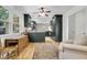 Open-concept kitchen with sleek dark cabinets, modern appliances, and adjacent living area with lots of windows at 679 Edmonds Dr, Charleston, SC 29412