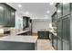 Spacious kitchen boasts stone countertops, stainless steel appliances, and dark cabinets for a modern design at 679 Edmonds Dr, Charleston, SC 29412