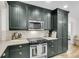 Updated kitchen featuring stainless steel oven, and microwave with sleek dark cabinetry at 679 Edmonds Dr, Charleston, SC 29412