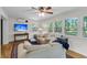 Bright living room with hardwood floors, plush seating, and views of the backyard at 679 Edmonds Dr, Charleston, SC 29412