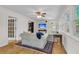 Cozy living room with hardwood floors, ceiling fan, and natural light; inviting and comfortable at 679 Edmonds Dr, Charleston, SC 29412