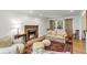Cozy living room with fireplace and a large window overlooking the yard at 679 Edmonds Dr, Charleston, SC 29412