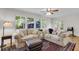 Inviting sunroom with abundant natural light, plush seating, and access to outdoor area at 679 Edmonds Dr, Charleston, SC 29412