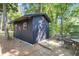 Backyard shed with wood ramp, patio, and outdoor dining area at 679 Edmonds Dr, Charleston, SC 29412