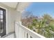 Charming balcony with a white railing and a beautiful view of palm trees and sky at 700 Daniel Ellis Drive # 5303, James Island, SC 29412