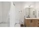 Beautiful bathroom features a shower with bench, white vanity, and modern fixtures at 700 Daniel Ellis Drive # 5303, James Island, SC 29412