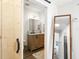 Bright bathroom features a modern vanity, sliding barn door and stylish fixtures at 700 Daniel Ellis Drive # 5303, James Island, SC 29412