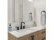 Stylish bathroom with a vessel sink, stone countertop, and modern black fixtures at 700 Daniel Ellis Drive # 5303, James Island, SC 29412