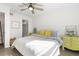 Sun-filled bedroom featuring a ceiling fan, walk-in closet, and cheery painted dressers at 700 Daniel Ellis Drive # 5303, James Island, SC 29412
