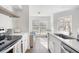 Updated kitchen with stainless appliances, quartz counters, and view to living space at 700 Daniel Ellis Drive # 5303, James Island, SC 29412