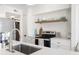 Bright kitchen features stainless appliances, quartz countertops, and open shelving at 700 Daniel Ellis Drive # 5303, James Island, SC 29412