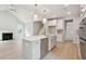 The bright kitchen features white cabinets, a center island, and stainless-steel appliances at 752 Minton Rd, Charleston, SC 29412
