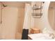 Clean bathroom with shower and storage baskets with a white and black shower curtain at 7712 Corley Dr, North Charleston, SC 29418