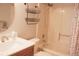 Cozy bathroom features a shower with tub and single sink vanity at 7712 Corley Dr, North Charleston, SC 29418