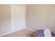 Neutral bedroom features bi-fold closet doors and beige carpeting at 7712 Corley Dr, North Charleston, SC 29418