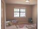 Bright bedroom with a window, mirror and decorative rugs at 7712 Corley Dr, North Charleston, SC 29418