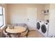 Bright kitchen with stainless steel appliances and a dining area with a view of the washer and dryer at 7712 Corley Dr, North Charleston, SC 29418