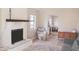 Inviting living room with fireplace, neutral palette, area rug, and plenty of natural light at 7712 Corley Dr, North Charleston, SC 29418