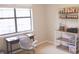Bright office space with desk and shelving by a large window at 7712 Corley Dr, North Charleston, SC 29418