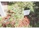 A lush Carolina Yard features vibrant flowers and a thriving green bush at 7712 Corley Dr, North Charleston, SC 29418