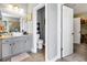 This bathroom includes modern grey cabinets and a conveniently placed toilet room at 7875 Berry Manor Ln, Edisto Island, SC 29438