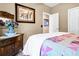 Bedroom showcasing decor, bedding, and an open doorway to another room at 7875 Berry Manor Ln, Edisto Island, SC 29438