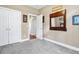 Bedroom with closet doors and an ornate mirror on the wall at 7875 Berry Manor Ln, Edisto Island, SC 29438