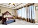 Tranquil bedroom with a decorative wood bed frame, carpet flooring and bright, natural light at 7875 Berry Manor Ln, Edisto Island, SC 29438
