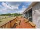 This deck is furnished with benches, wood chairs, and a gorgeous fenced backyard view at 7875 Berry Manor Ln, Edisto Island, SC 29438