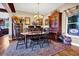 Elegant dining room features a chandelier, hutch, and a wooden table with seating for six at 7875 Berry Manor Ln, Edisto Island, SC 29438