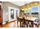 Bright dining room with hardwood floors and natural light from the windows to the backyard at 7875 Berry Manor Ln, Edisto Island, SC 29438