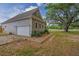 Side view of home with garage featuring a brick paver driveway at 7875 Berry Manor Ln, Edisto Island, SC 29438