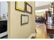 Hallway leading to dining area, with framed certificates hanging on the wall at 7875 Berry Manor Ln, Edisto Island, SC 29438