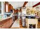 Modern kitchen featuring stone accents, stainless appliances, and wooden cabinetry at 7875 Berry Manor Ln, Edisto Island, SC 29438